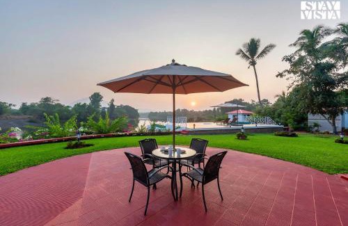 Vada Villa | StayVista's Waterway Retreat - Lakeside Oasis with Infinity Pool