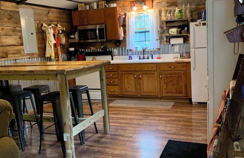 Cool Ridge Cabina | Step back in time with this unique cozy cabin by the creek.