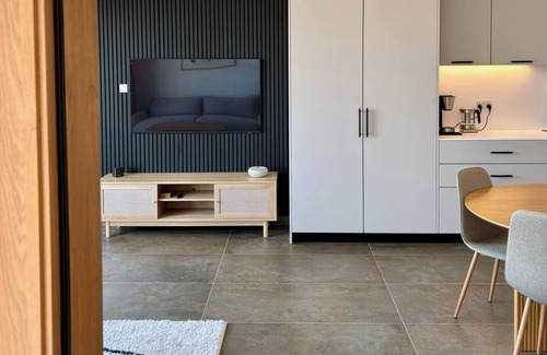 Mellieħa Heights Apartamento | Step inside to discover a modern and elegantly decorated space, featuring two spacious bedrooms with ample storage, ensuring a restful and convenient stay. The open-plan living area boasts contemporary furnishings, providing a chic and cozy atmospher