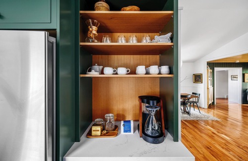 Omena Cabaña | Stillwater Cottage - lakefront with chefs kitchen, fireplace, firepit