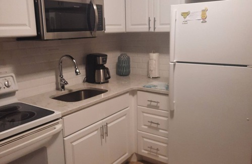 Caine Woods Condominio | Familia 1bedroom amigable / 1bathwalk a la playa. Wifi gratuito Dos grandes de la piscina.