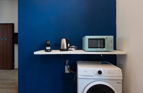 San Donato - Campidoglio Apartamento | Studio apartment with double bed, armchair bed and equipped kitchenette.