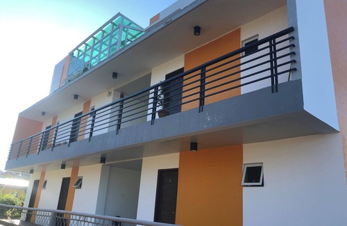 Bacnotan Apartamento | Studio Suite in a peaceful green, beach front space.This unit can sleep up to 6!