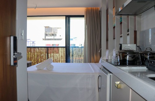 Jardim Oceania Apartamento | Studio com Varanda cama Queen