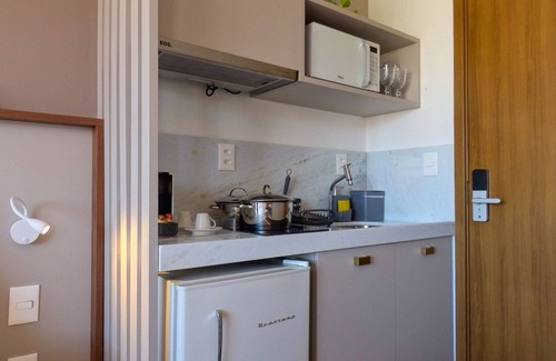 Jardim Oceania Apartamento | Studio com Varanda cama Queen