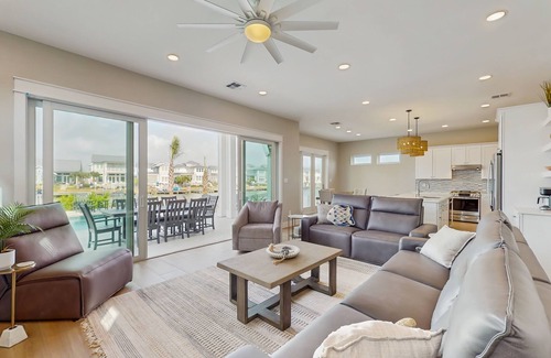 Rockport Casa | Stunning canal front home with private pool, fire pit, and boat dock