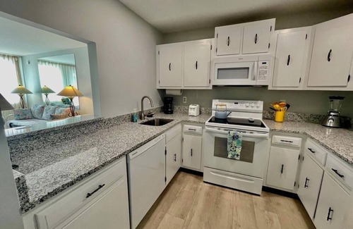 The Pines Condominio | Stunning Ocean Views from Fifth-Floor Condo with Pool & Off-Street Parking!