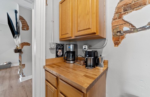 Graham Casa | Stylish downtown home: private hot tub, outdoor pizza oven & bumper pool table