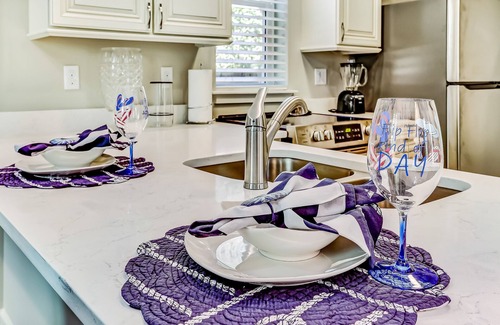 American Beach Condominio | Stylish & sun-filled retreat with large patio & fireplace - near beaches & golf
