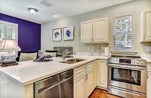 American Beach Condominio | Stylish & sun-filled retreat with large patio & fireplace - near beaches & golf