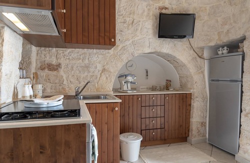 Castellana Grotte Villa | Trulli con estilo con piscina privada para 4 personas en Puglia