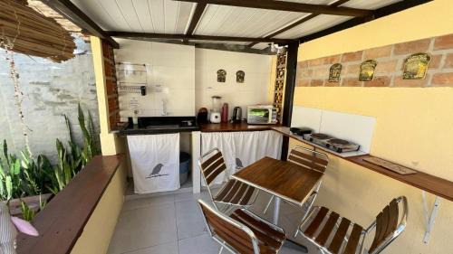 Cumuruxatiba Casa | Suítes Curió - Passarim Hospedagem