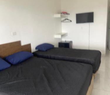 Jardim Praiano Casa | Suites mirante da Enseada