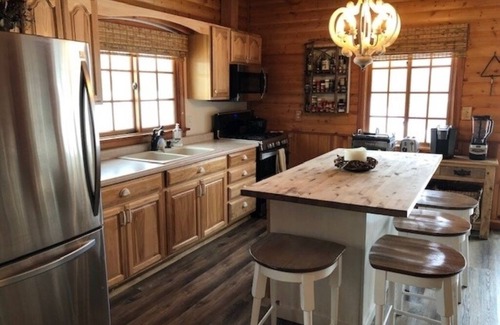 Amery Cabina | Sunset Cottage on Lake Wapogasset, Amery WI with Bunk Room, Hot Tub, AC, & more