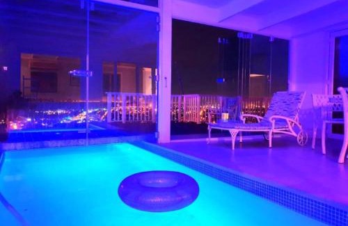 Mountainside Casa | 'The Bolussi Beachhouse', sleeps 12 in 6 en-suite bedrooms with Indoor Pool