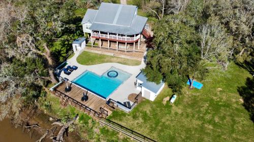 Cedar Lane Casa | The San Bernard River waterfront provides private access to a spa, boat ramp, and jet skiing