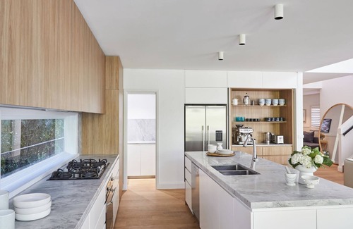Palm Beach Casa | This home matches quaint beachside charm with luxurious comfort.