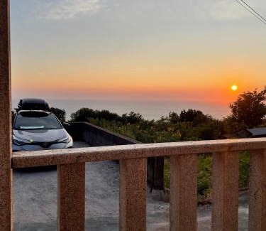 Oia Casa | Tiny house with sunset over the ocean