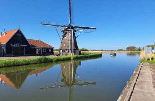 Oterleek Apartamento | Tinyhouse NATUURHUISJE met veranda Bij de Molen tussen Alkmaar en Hoorn