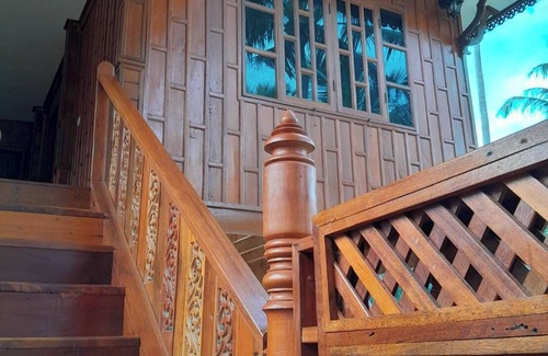 Thong Chai Casa | Traditional Thai wooden house on stilts set in a coconut orchard near the beach