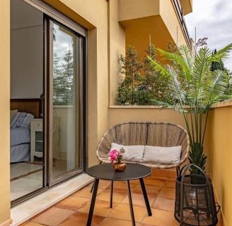 Sotogrande Apartamento | Tropical Sunset Paradise with Pool and Free Parking