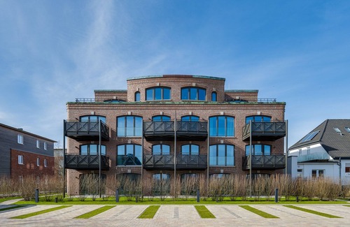List Apartamento | Turtle Bay Suite - Luxury on 65m² in List, Sylt with a Fireplace and Balcony.