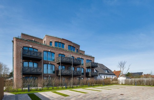 List Apartamento | Turtle Bay Suite - Luxury on 65m² in List, Sylt with a Fireplace and Balcony.