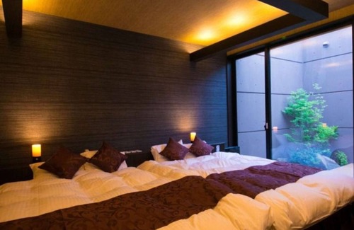 Oita Hotel | Twin beds tatami onsen openair jacuzzi bath / Oita Ōita