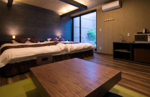 Oita Hotel | Twin beds tatami onsen openair jacuzzi bath / Oita Ōita