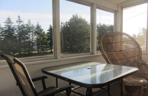 Morell Cabaña | Two Bedroom Cottage With Open Concept Leading To Large Patio And Screened Porch.