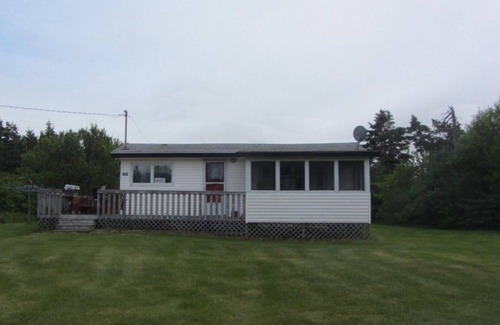 Morell Cabaña | Two Bedroom Cottage With Open Concept Leading To Large Patio And Screened Porch.