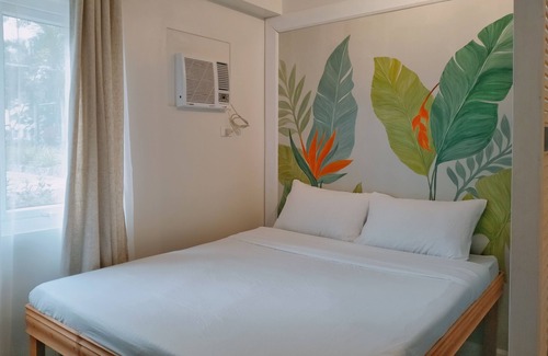 Guadalupe Apartamento | Two separate studio units on the same floor of a midrise condominium building.