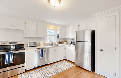 Harwich Casa | Two-story dog-friendly retreat with enclosed yard, playset, W/D, & firepit