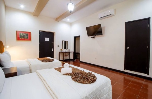 Centro Hotel | Twofold Escape: 2 Stays, 4 Beds, Steps from City Attractions