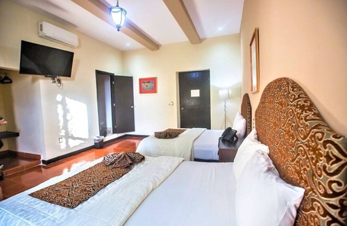 Centro Hotel | Twofold Escape: 2 Stays, 4 Beds, Steps from City Attractions