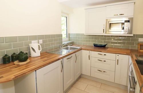 Pendine Cabaña | TY'R ARDD, admite mascotas, con chimenea en Pendine, Ref 984541