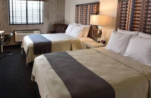 Broken Arrow Hotel | Unwind in Style: Spacious Suites & Relaxing Poolside Retreat | 4 Units