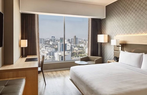 Armendariz Hotel | Unwind with Partial Ocean Views | Ambient Glow and Elegant Coastal Touches