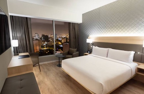 Armendariz Hotel | Unwind with Partial Ocean Views | Ambient Glow and Elegant Coastal Touches