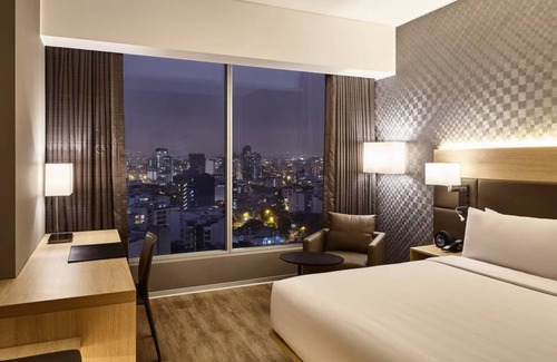 Armendariz Hotel | Unwind with Partial Ocean Views | Ambient Glow and Elegant Coastal Touches