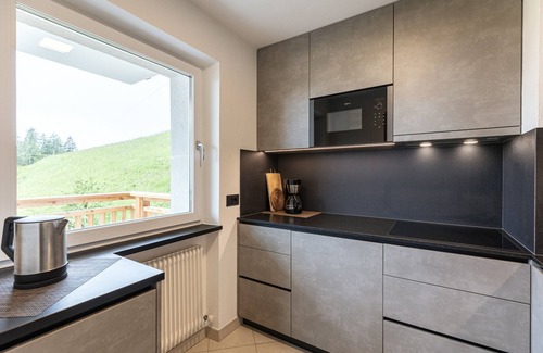 Santa Cristina Val Gardena Apartamento | Apartamento de vacaciones "Comfort La Mana" con vistas a la montaña, Wi-Fi y jardín