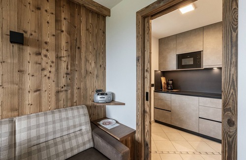 Santa Cristina Val Gardena Apartamento | Apartamento de vacaciones "Comfort La Mana" con vistas a la montaña, Wi-Fi y jardín