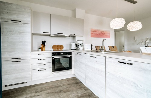 Schillig Apartamento | Vacation apartment with a view of the sea and meadows, sauna & electric fireplace for relax