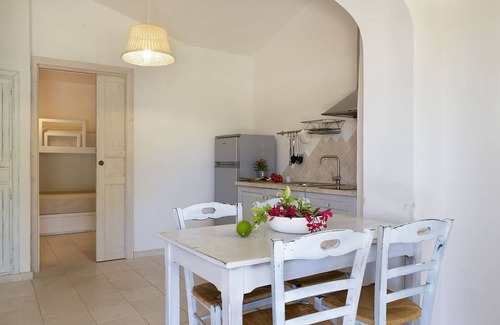La Conia Casa | Casa de vacaciones "Casa giardino e spiaggia a piedi" cerca de la playa con jardín y terraza
