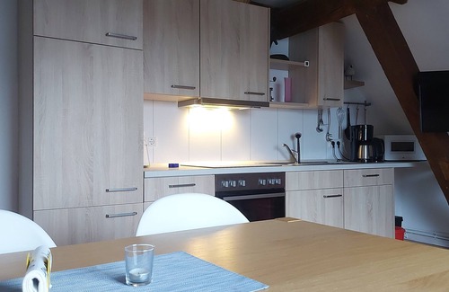 Eckwarden Apartamento | Vacation home Herter, WiFi, garden, play equipment, lounger / play area, barbecue
