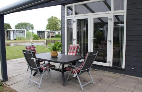 Lathum Chalet De Esquí | Vakantiehuis met vijverzicht