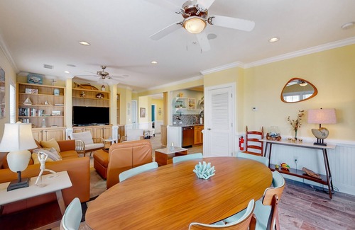 Hatteras Condominio | Vibrant beach retreat with washer/dryer, central AC, deck, & pool access