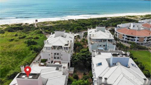 Ingleses do Rio Vermelho Apartamento | Villa Giardino - Condomínio de Frente para o Mar - Piscina, Quadra Esportiva, Churrasqueira - 5 Pessoas