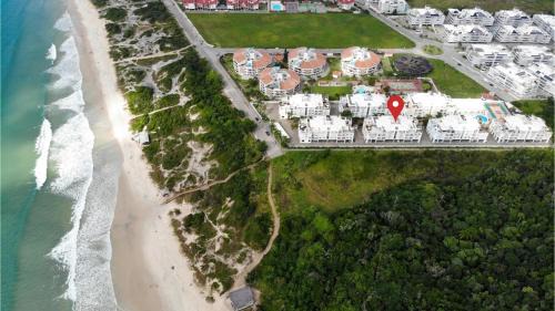 Ingleses do Rio Vermelho Apartamento | Villa Giardino - Condomínio de Frente para o Mar - Piscina, Quadra Esportiva, Churrasqueira - 5 Pessoas