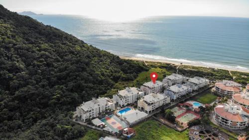 Ingleses do Rio Vermelho Apartamento | Villa Giardino - Condomínio de Frente para o Mar - Piscina, Quadra Esportiva, Churrasqueira - 5 Pessoas